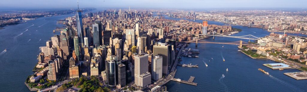 Banner: Arial view of New York City's five boroughs.