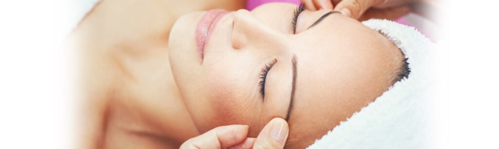 Image: Woman with eyes closed enjoying spa treatment.