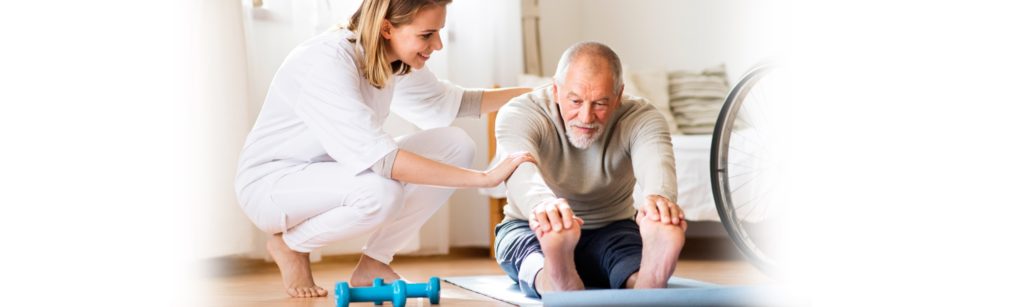 Image of healthcare worker leading a patient through physical therapy in their home