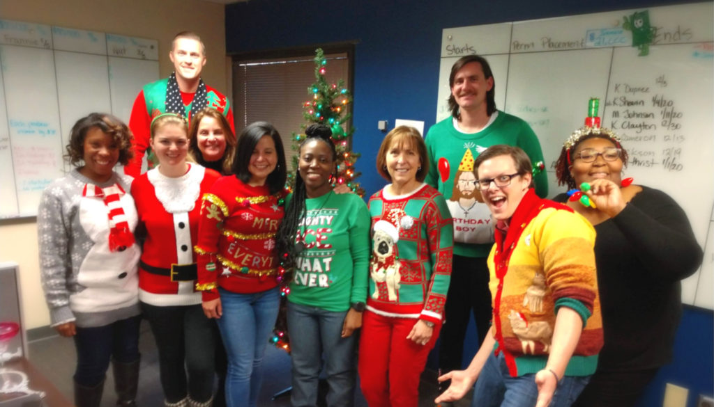 image of hospital staff posing for camera in Christmas outfits