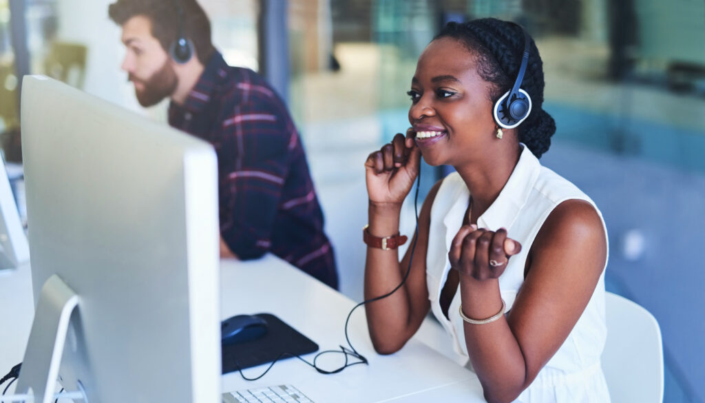Image: Woman taking a call depicting a healthcare recruiter.