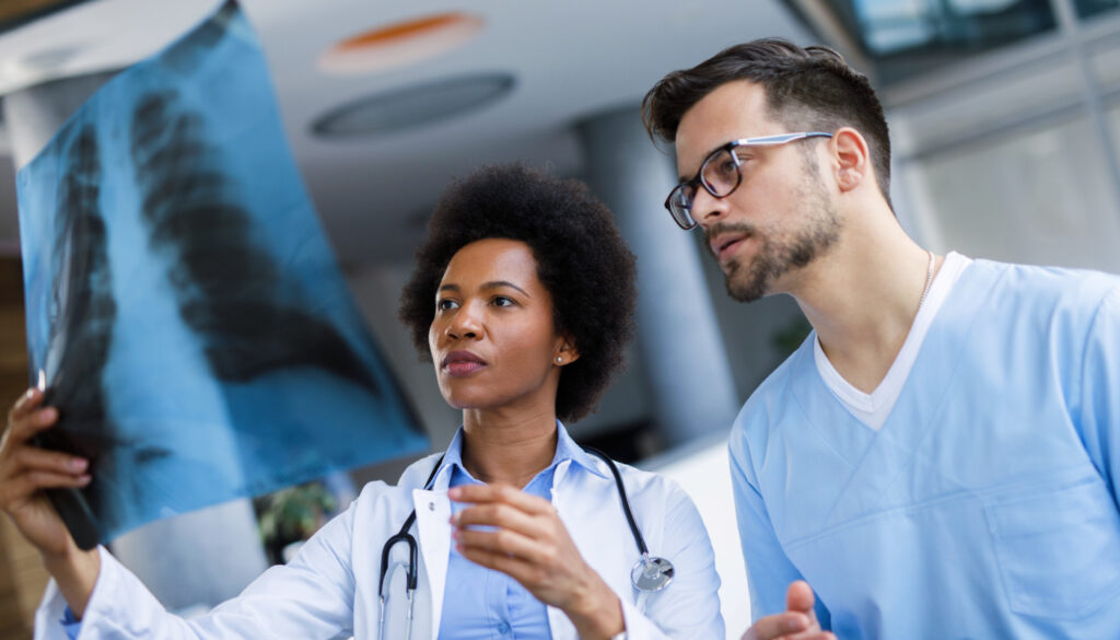 Image of two nurses analyzing an X-ray scan