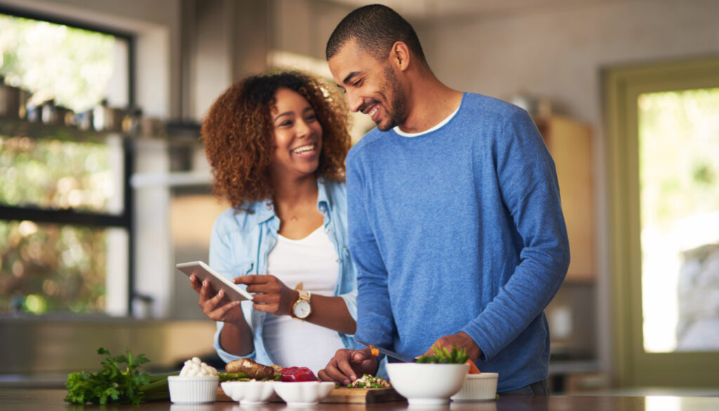 Image: a couple preparing healthy food together to combat covid-19