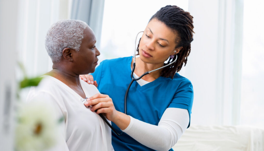 Image: Nurse measuring patient's heartrate with stethoscope for respiratory care week