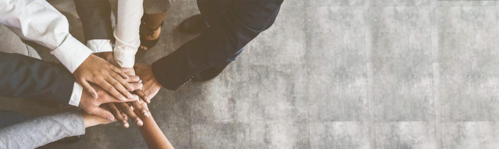 banner image of an overhead shot of a hands stack
