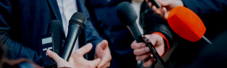 image of hands holding microphones