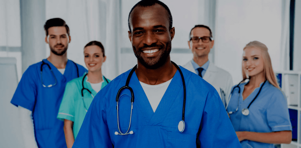 photo of five healthcare professionals smiling for the camera