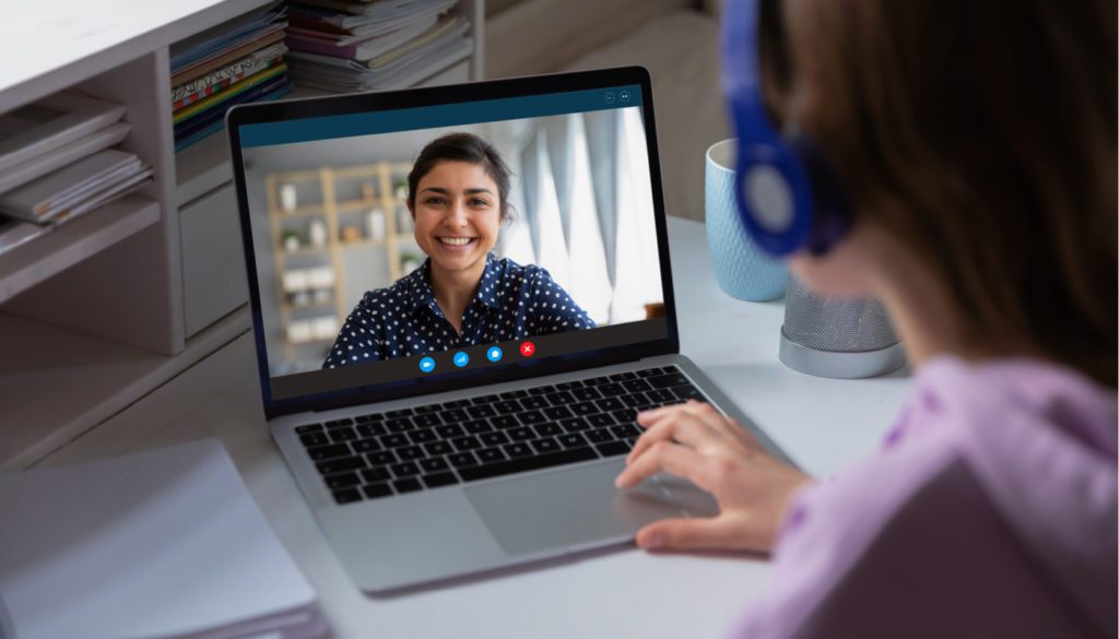 image: two women speaking with each other via a video call on the computer