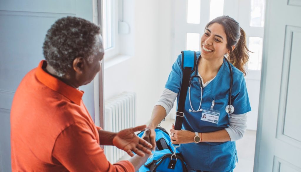 Image: Traveling nurse visiting patient at home