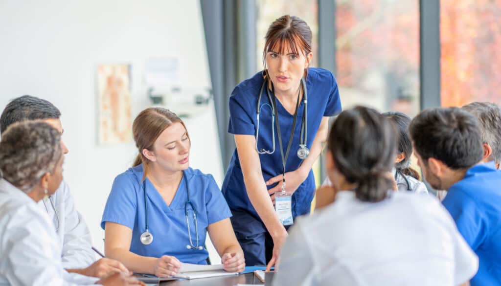 Image: Medical staff holding a round table meeting