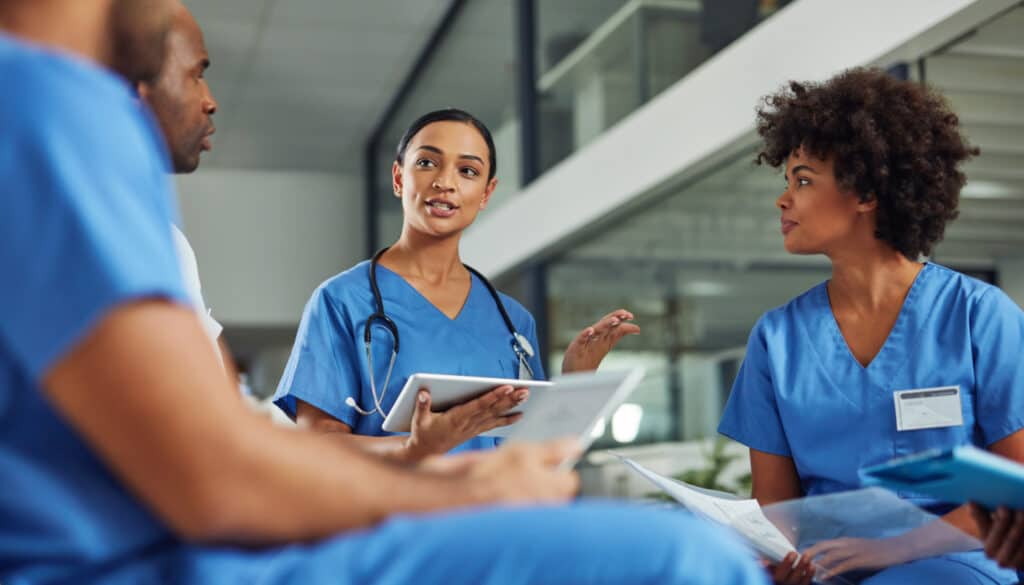 an image of a group of nurses talking in a hospital