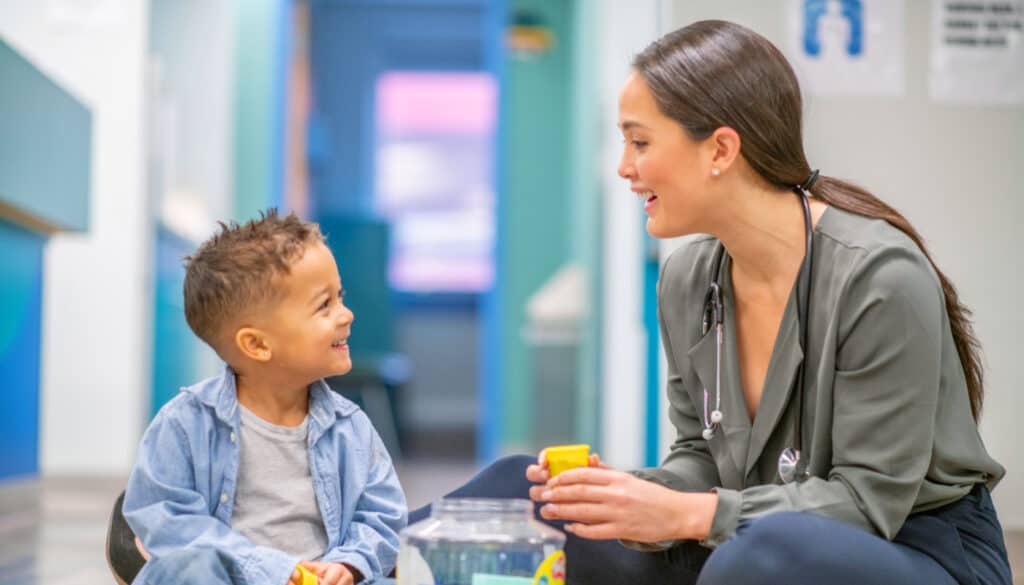 SLP speech language pathologist job with patient