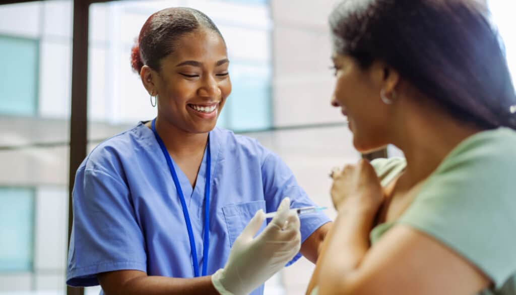 A nurse is using needle and sharp safety