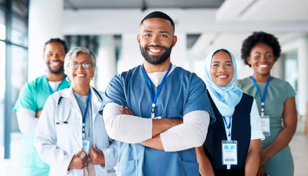 A group of nurses standing in a hallway.