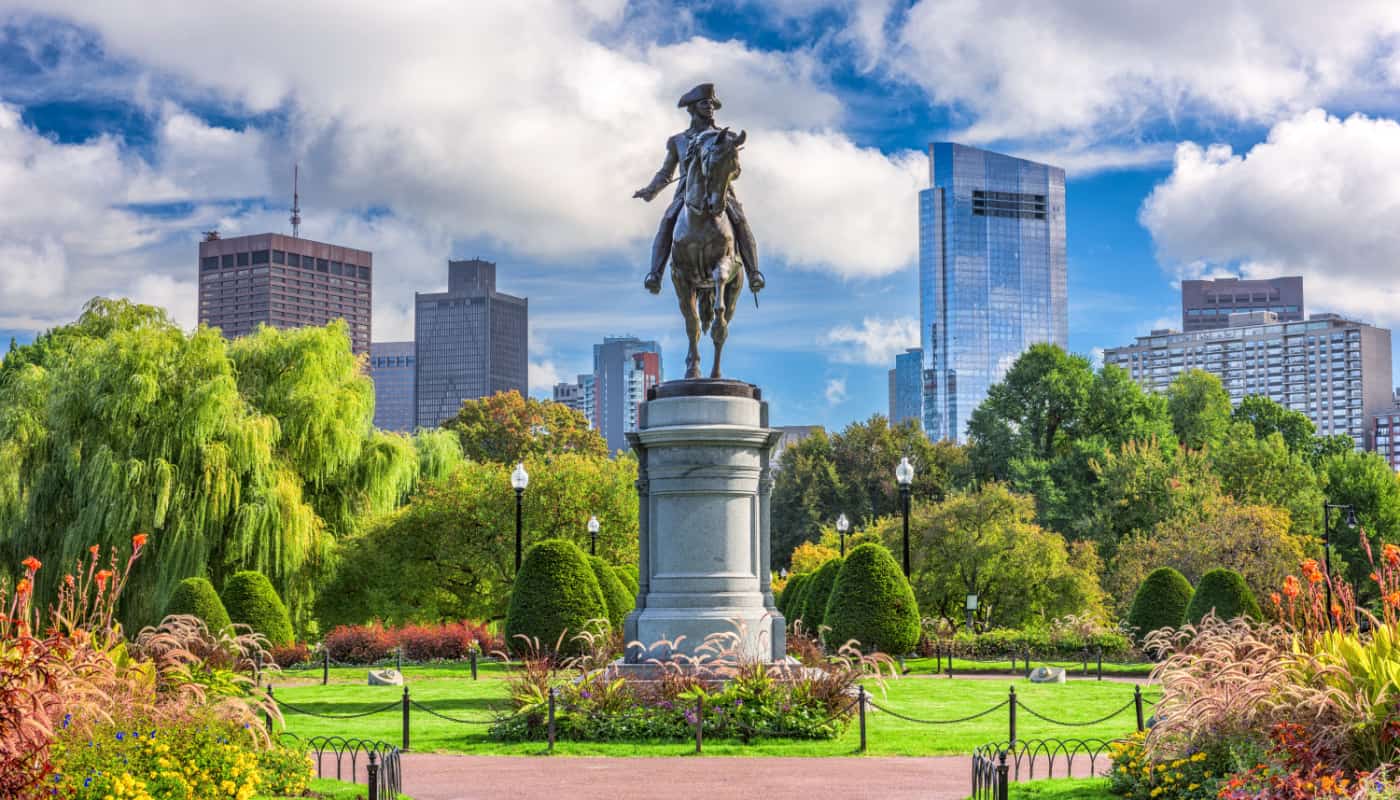 A statue of a man in a park in boston, massachusetts.