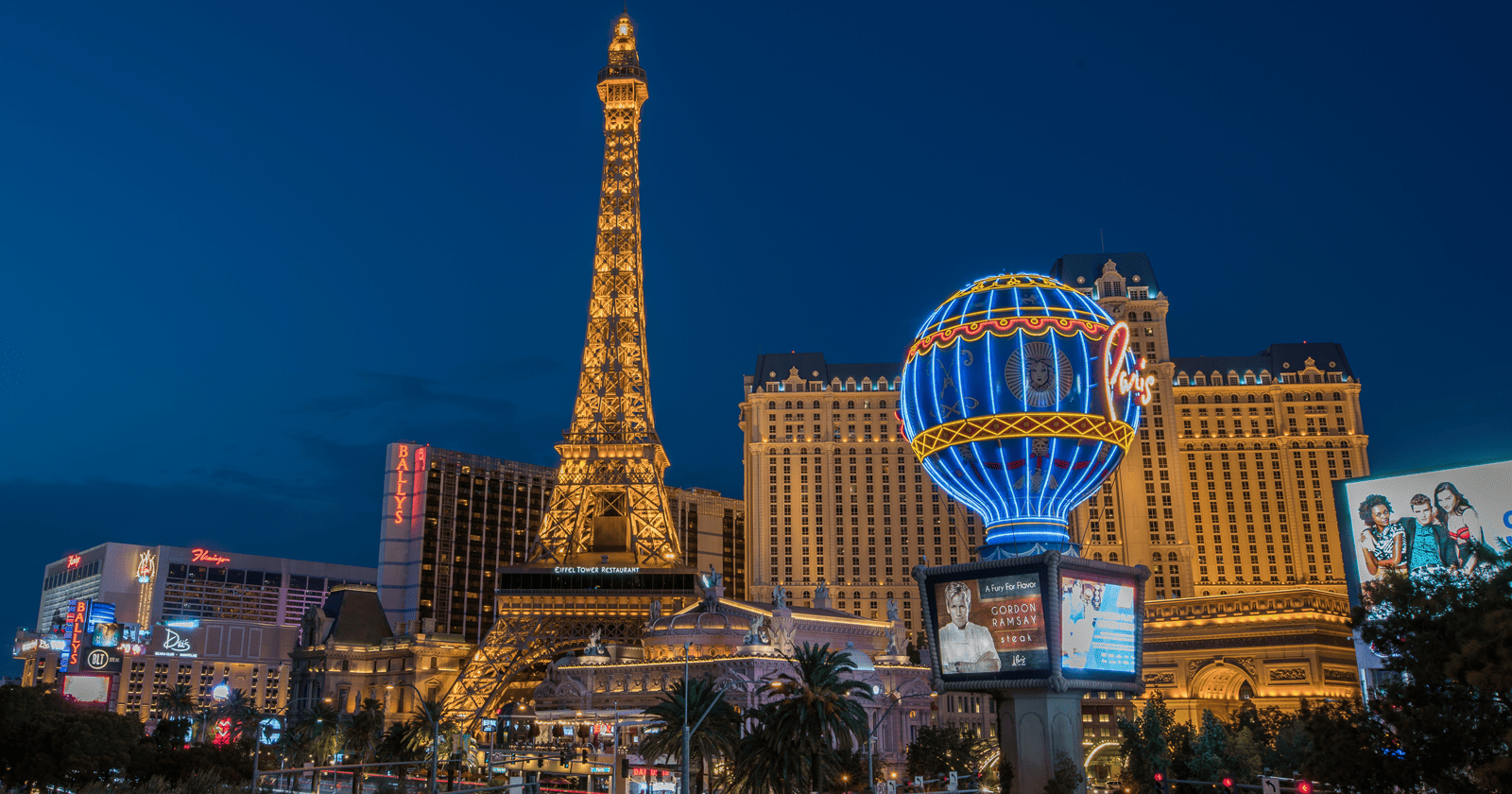 The eiffel tower is lit up at night.
