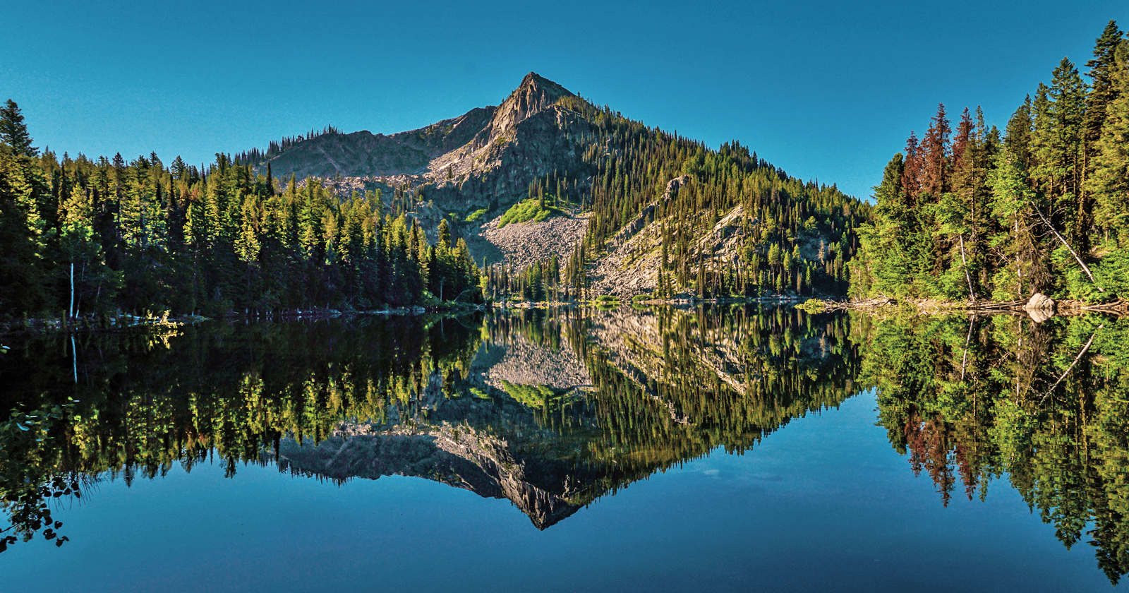 A mountain is reflected in a lake.