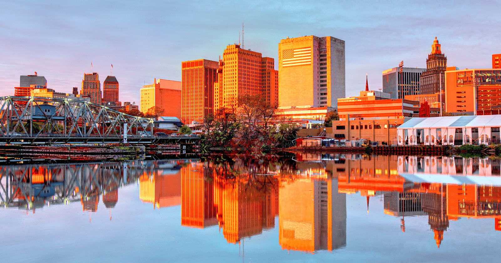 A city skyline reflected in a body of water.