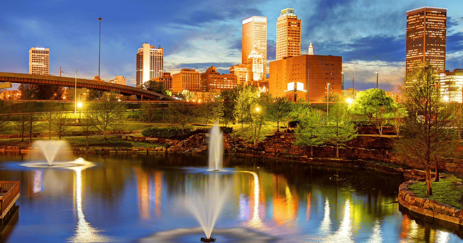 A city skyline in the distance.
