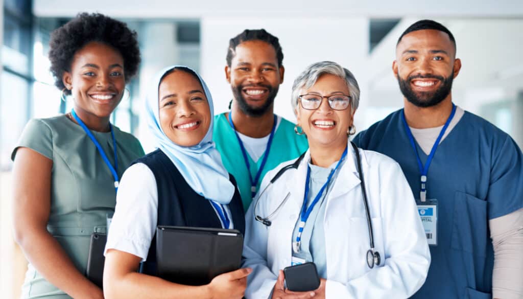 A group of doctors and nurses standing together.