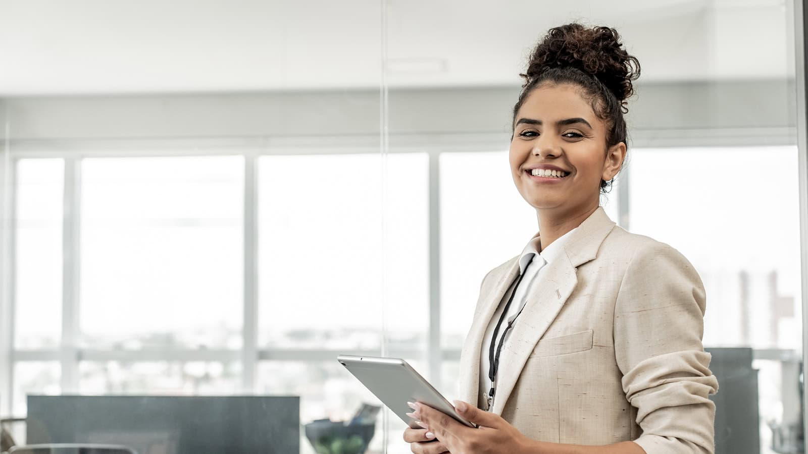 Banner: Image of a woman smiling, with a caption that reads, from caring support to fulfilling your calling.